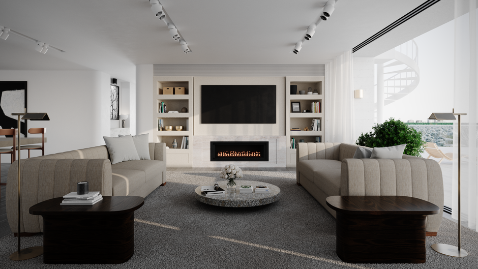 Living room of a renovated bungalow with a sofa, rug, and built-in shelves